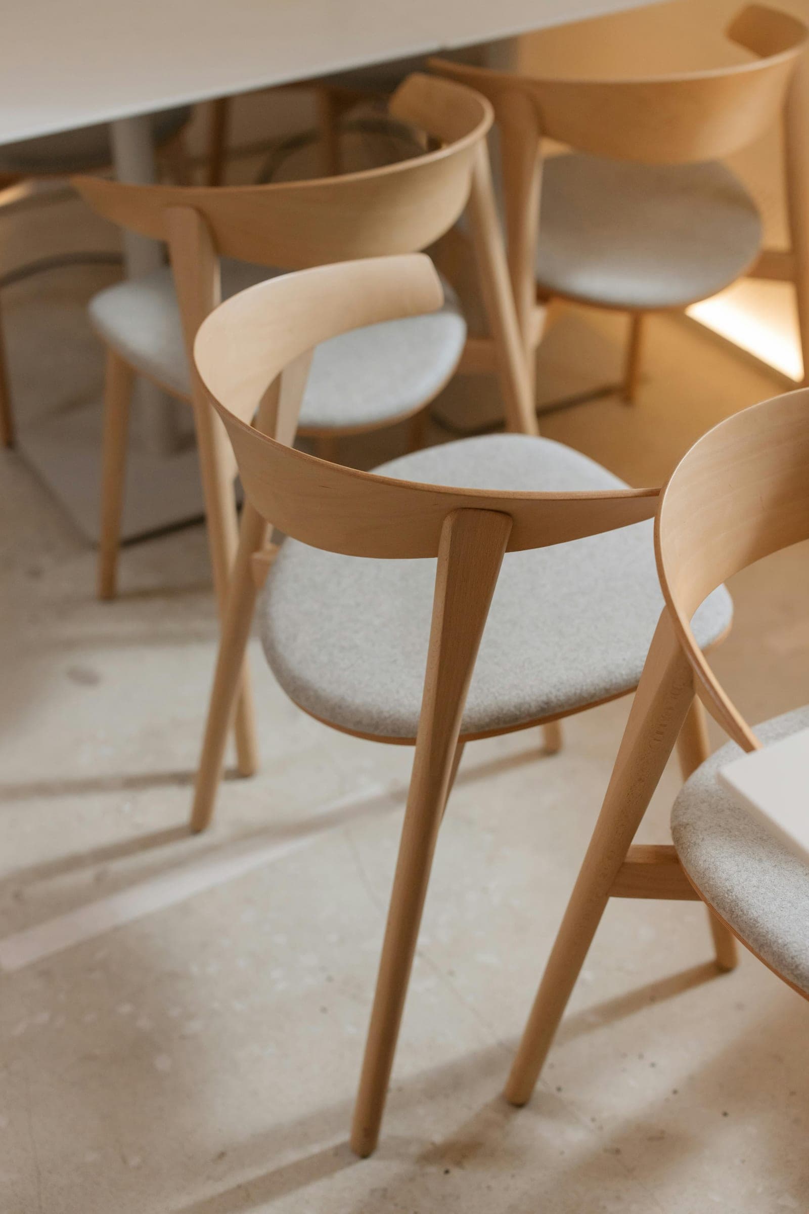 Timber chairs around a meeting table