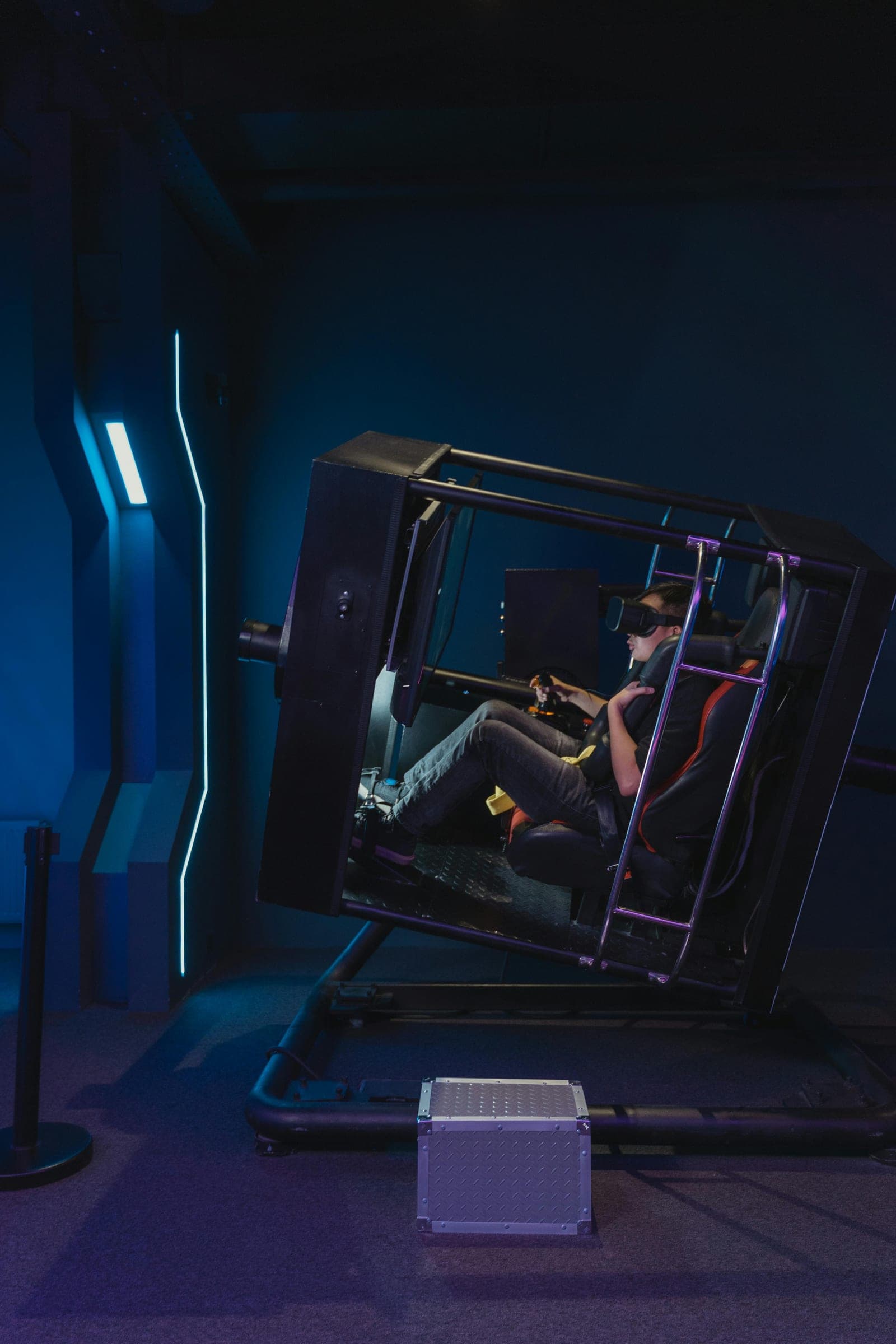 A racing simulator cockpit lit in blue