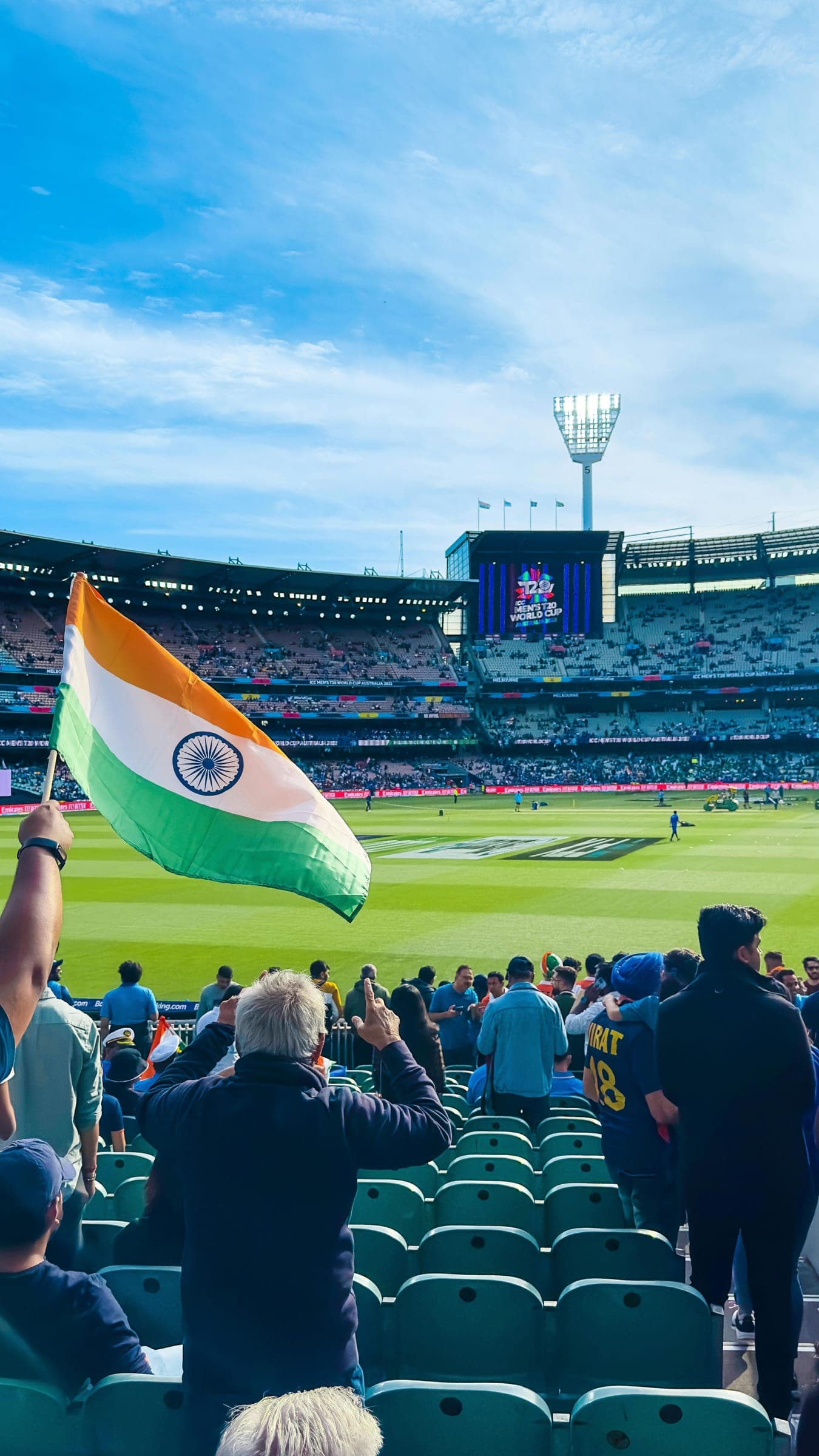 An Indian flag waved in the stands of a cricket stadium
