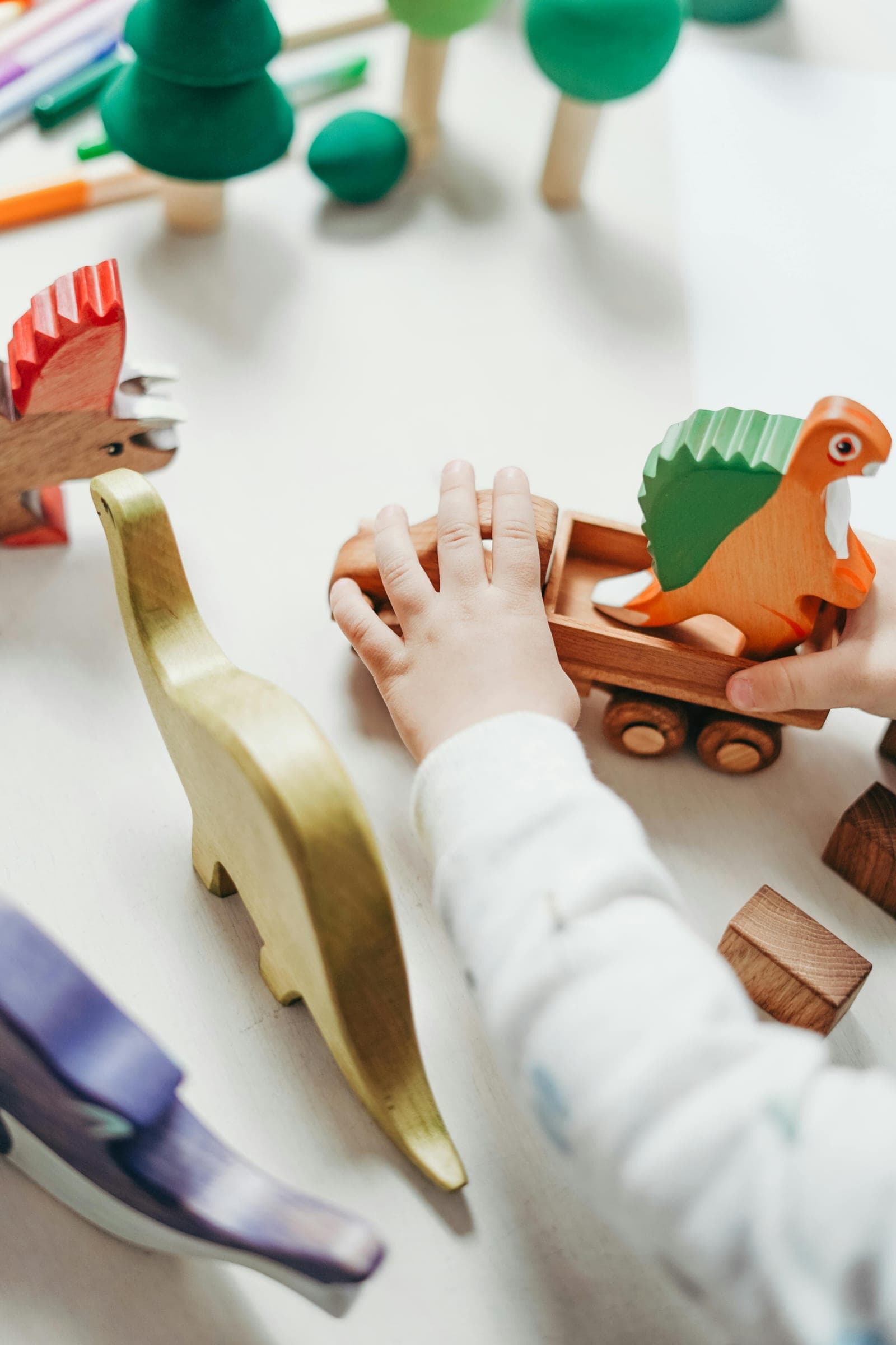 A child playing with wooden toys
