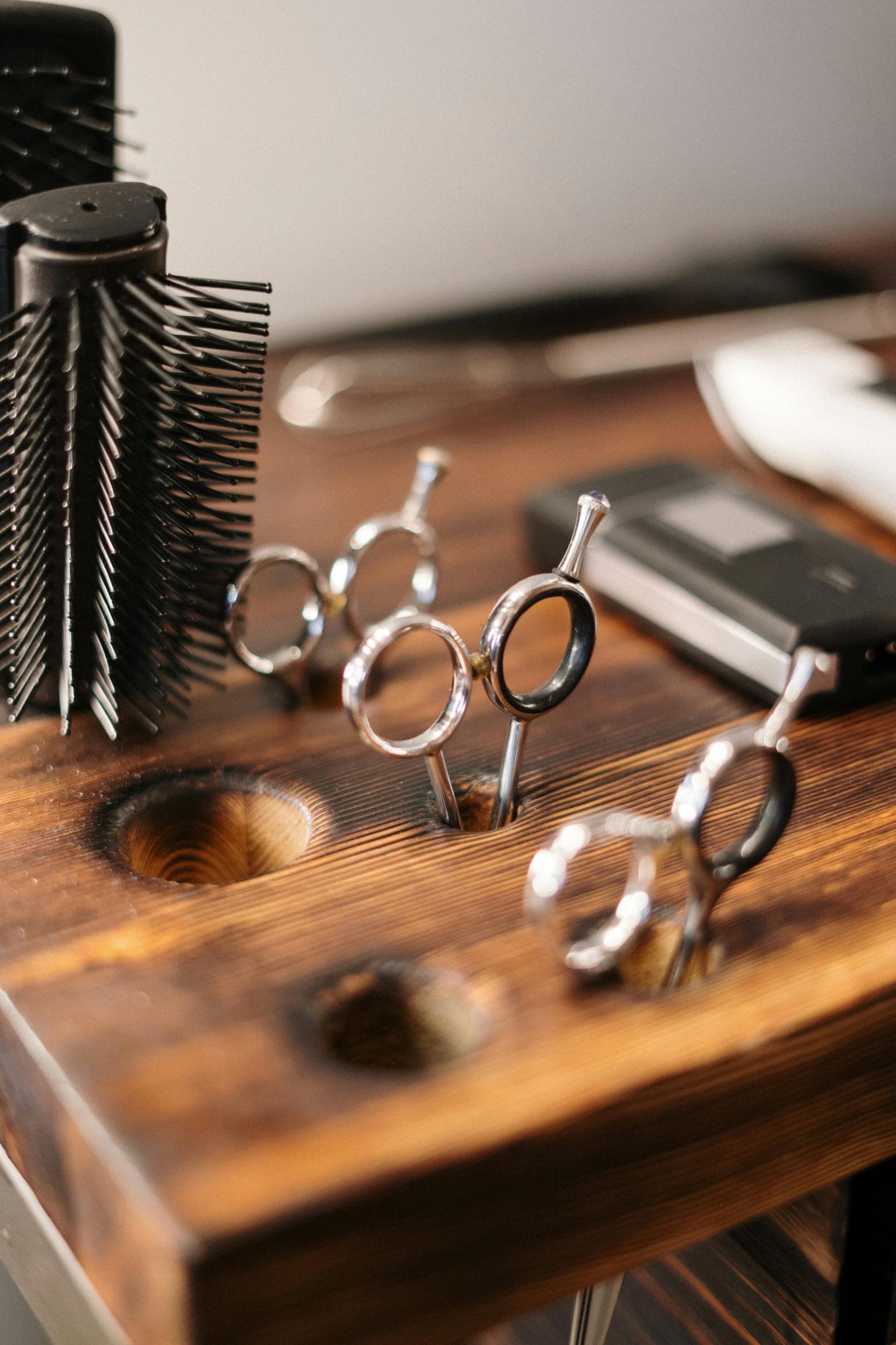 A salon station with scissors and combs