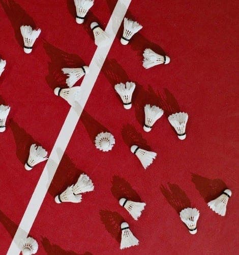 Shuttlecocks on a red court
