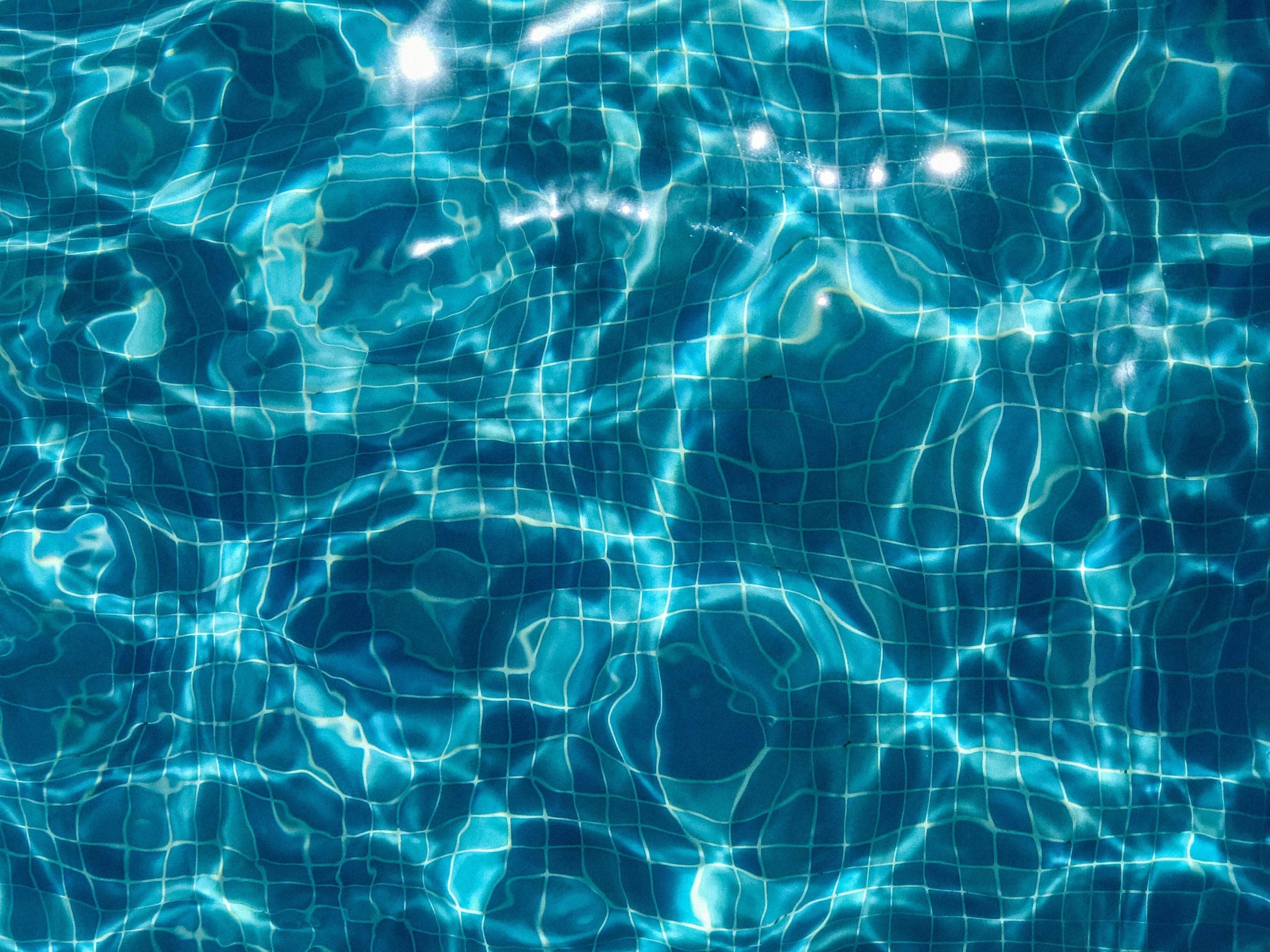 Light rippling across the floor of a pool